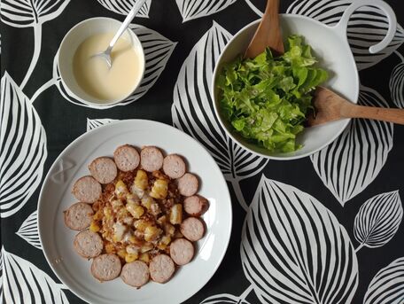RECIPE MAIN IMAGE Saucisse de Morteau, pommes de terre aux oignons confits et cancoillotte chaude